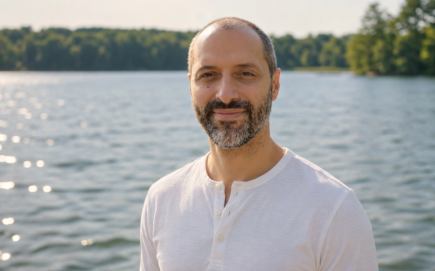 Tom Meli beside a lake